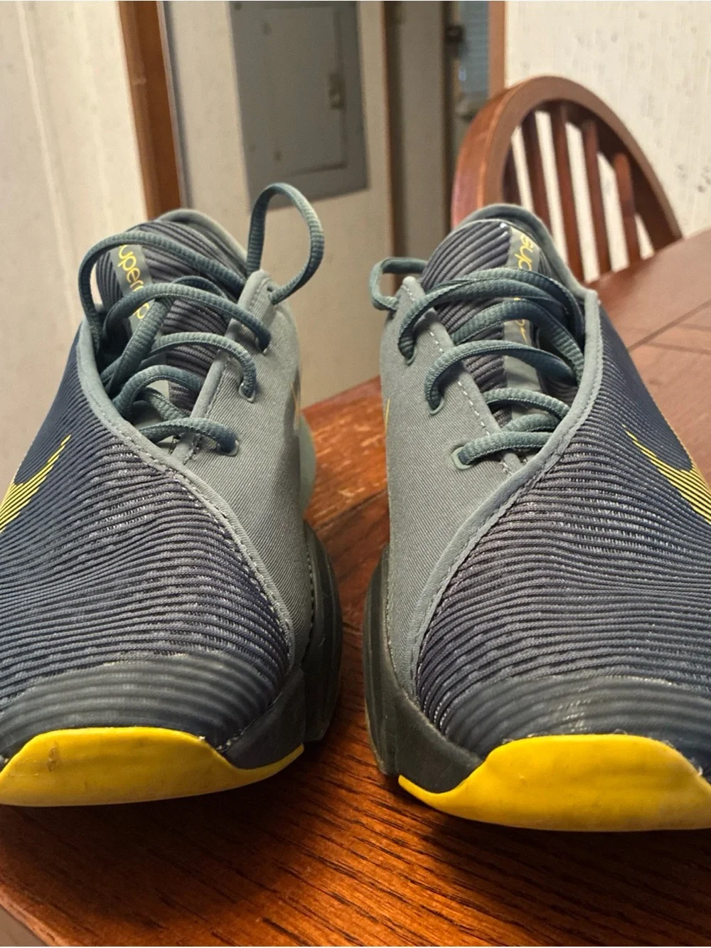 Nike Men’s Gray Athletic Shoes with Yellow Swoosh